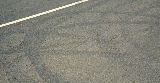 Skid marks on a Texas road after a truck or car accident